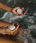 shampoo bar and conditioner bar over ocean