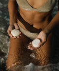 shampoo bar and conditioner bar in hands